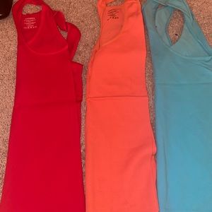 3 tanks- red, orange and blue. Slim fit but very stretchy and soft!